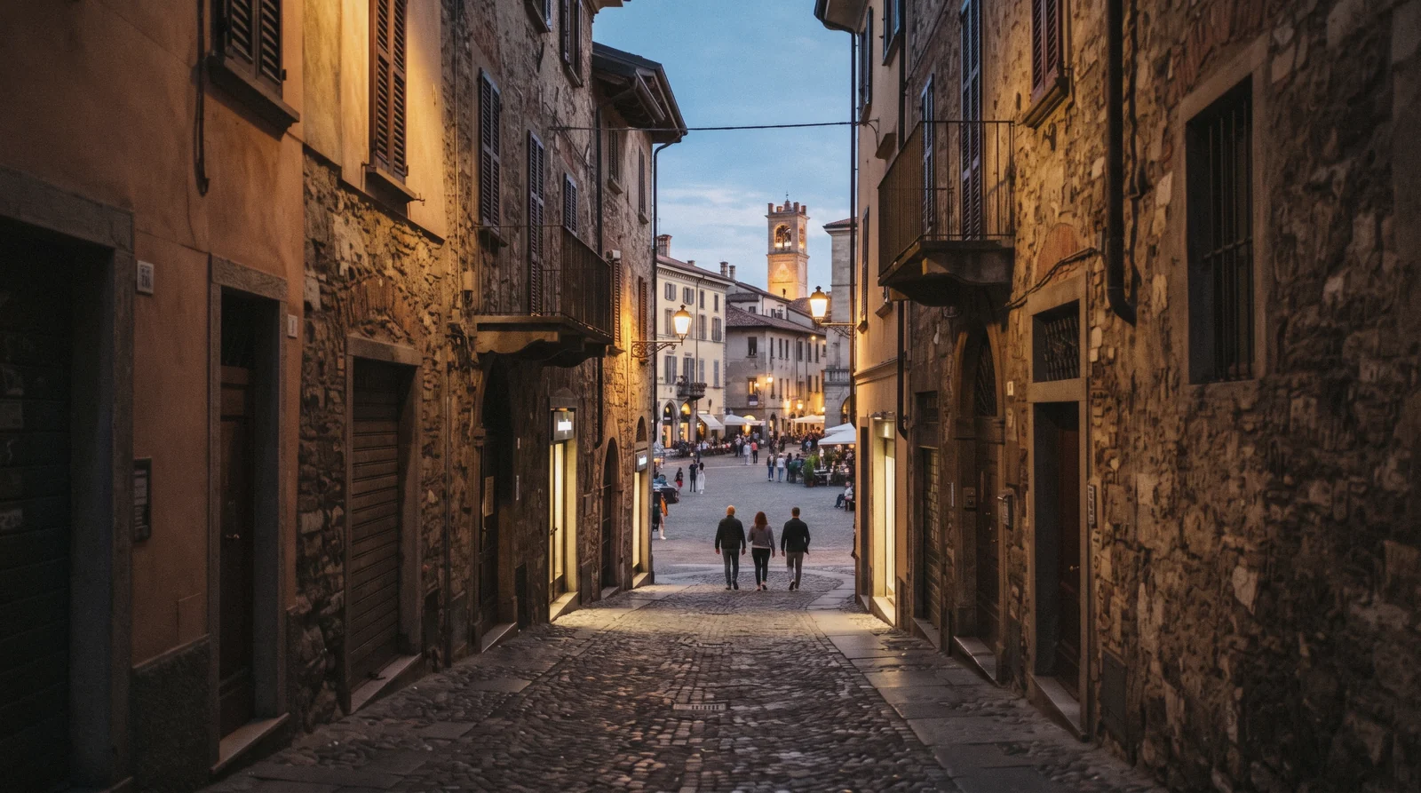 The Venetian walls and bell towers of Citta Alta rising above the plain, the walled hill town at the centre of a Bergamo day trip