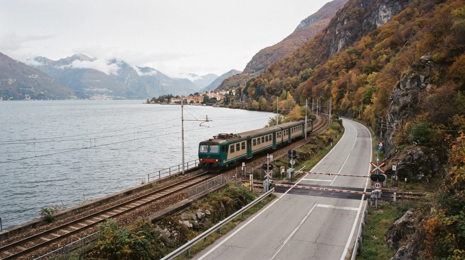 A regional train running beside the water on the eastern shore, the line most day trips from Lake Como start on