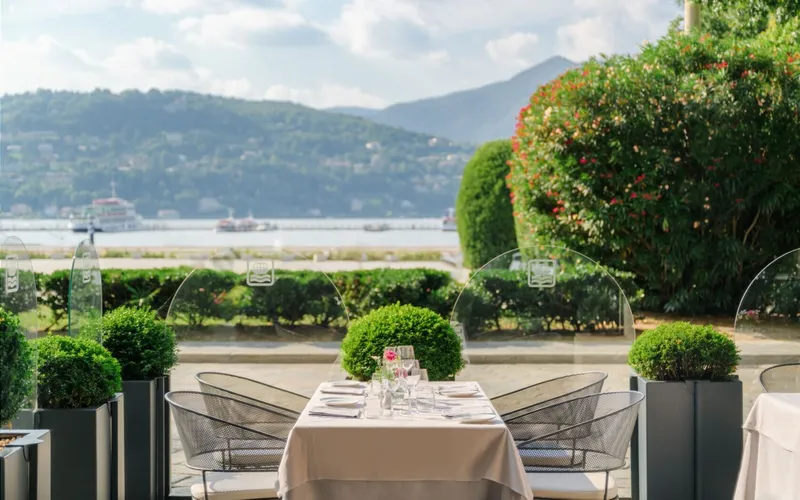 A terrace table with a lake view at Hotel Barchetta Excelsior, a Lake Como hotel in Como