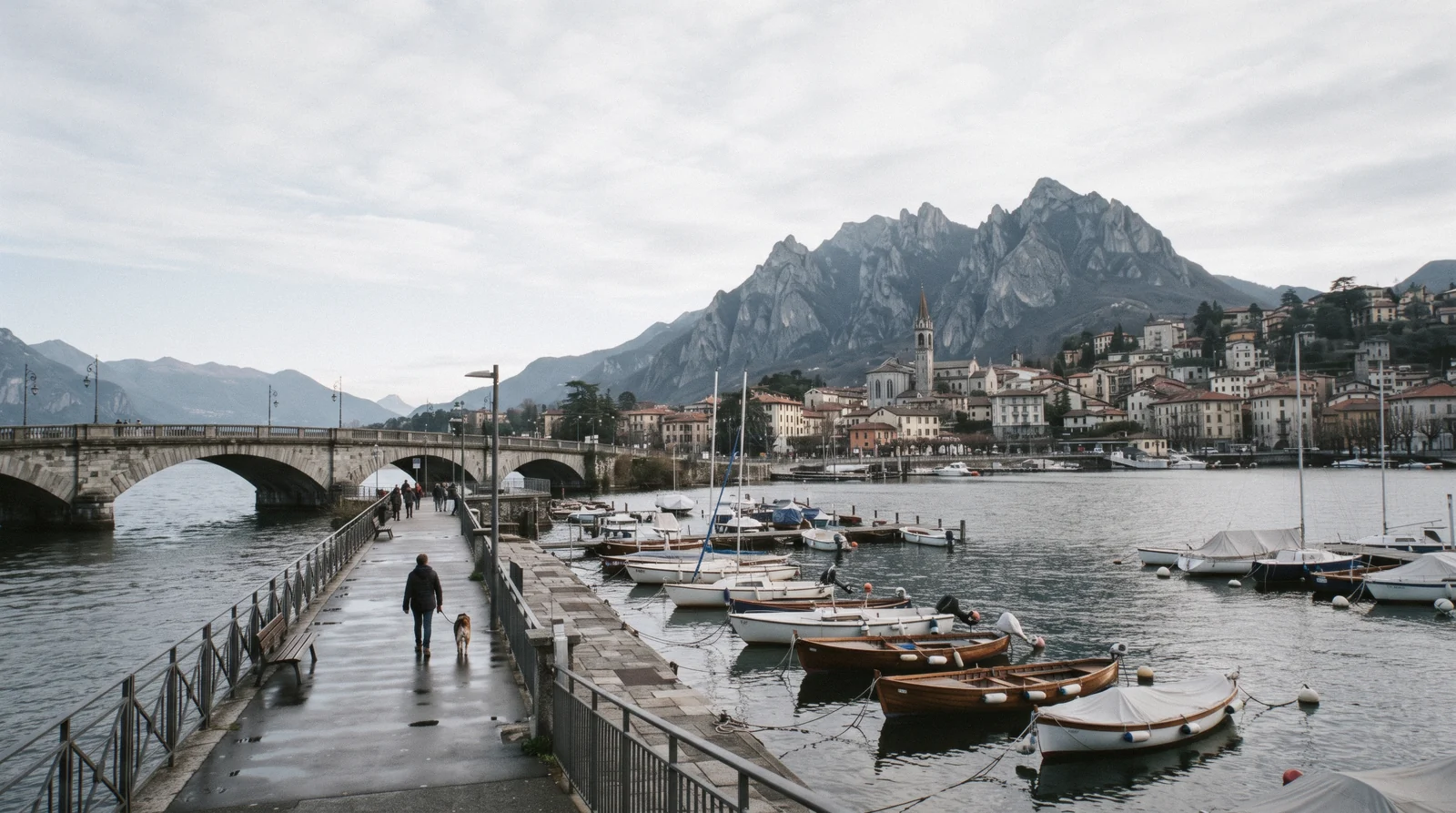 The lakefront of Lecco with the limestone ridges of the Grigne rising steeply behind the town