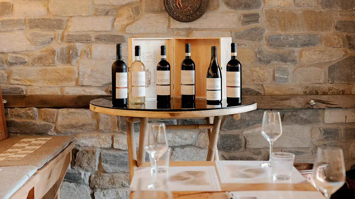 Wine tasting table set with glasses overlooking Lake Como above Bellagio