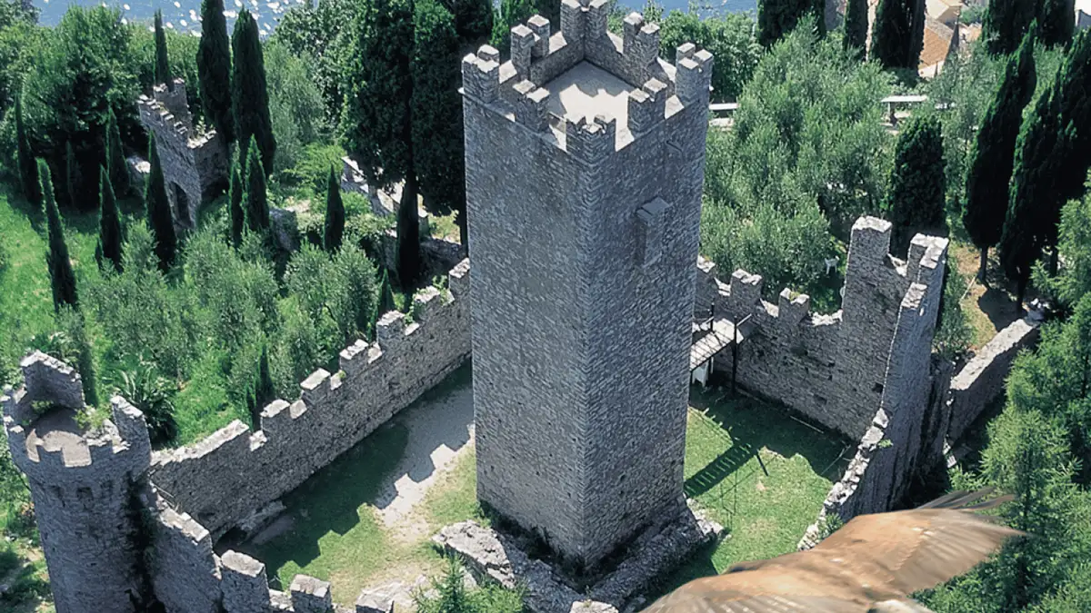 Castello di Vezio tower on the ridge above Varenna with Lake Como below